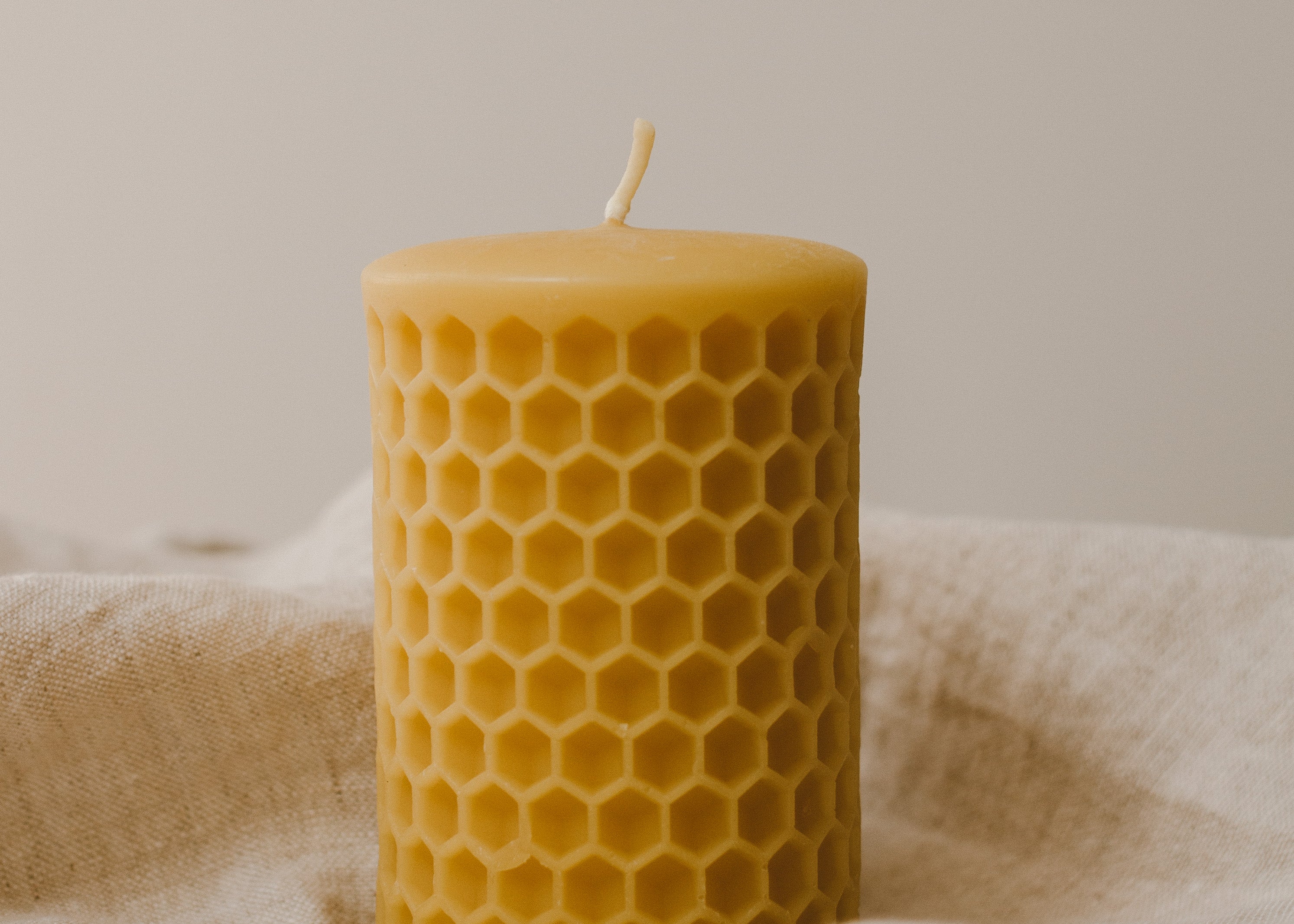 Honeycomb Beeswax Pillar Candle by Goldrick. Natural Candles, Eco-Friendly. Perfect for eco-conscious consumers.