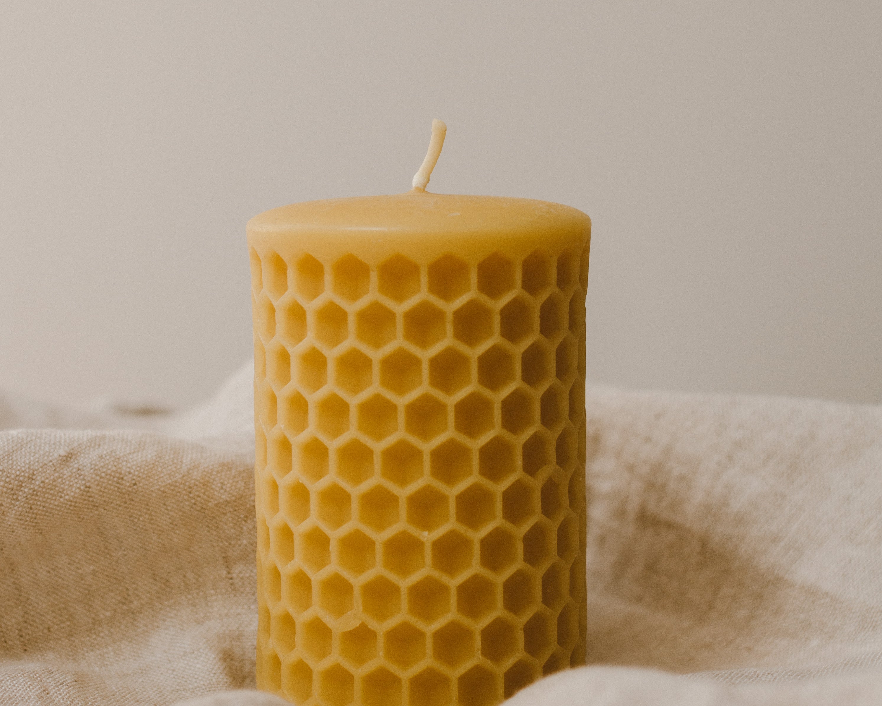 Honeycomb Beeswax Pillar Candle by Goldrick. Natural Candles, Eco-Friendly. Perfect for eco-conscious consumers.