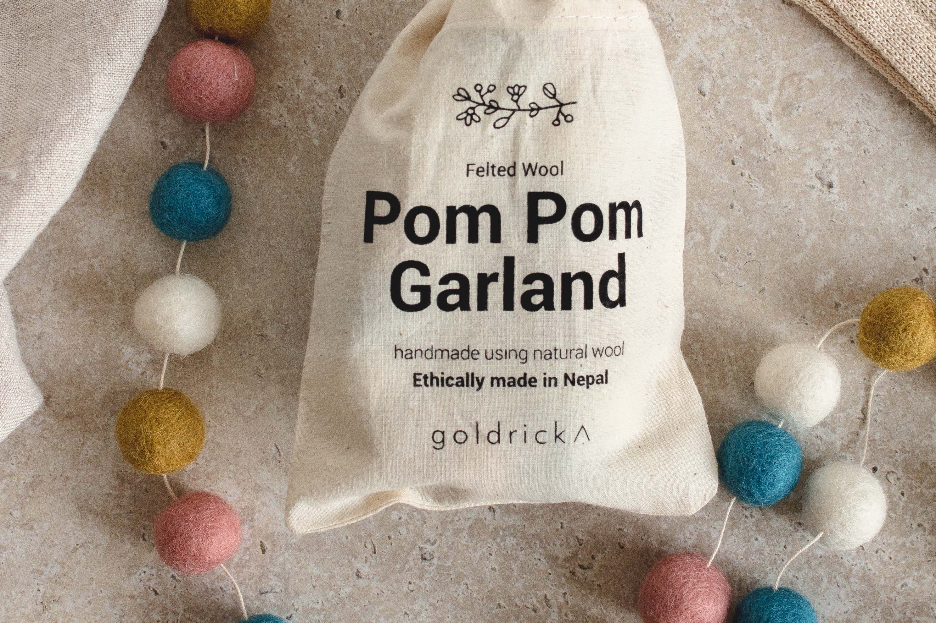 Pom Pom Garland | Natural Wool by Goldrick. Handmade Gifts, Gifting. Perfect for eco-conscious consumers.
